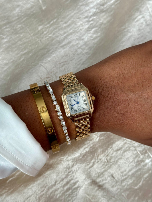Square shaped gold watch